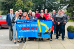 Conservative candidates for the Bassetlaw District Council 2023 local elections holding a banner opposing Labour's housing plan