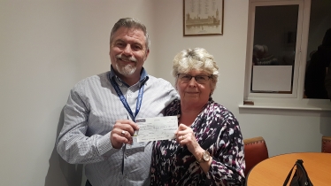 Mrs Bowles being presented with a cheque from Drew Smith, the Chairman of Bassetlaw Conservative Association